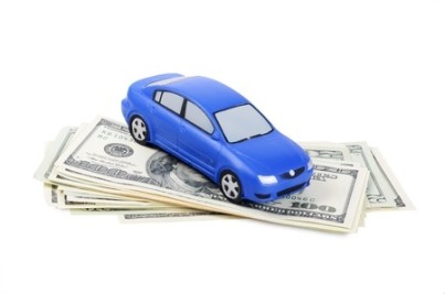 Toy car for dollar banknotes as background